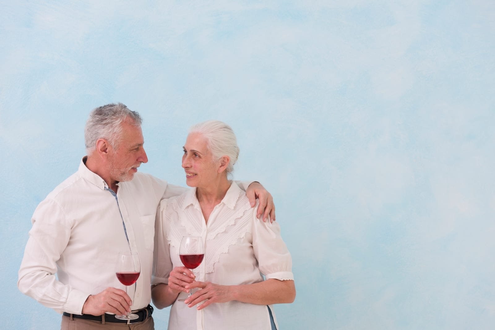 Mature couple sharing a relaxed date with wine